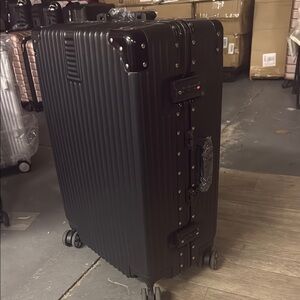 Black Hard Shell Rolling Suitcase